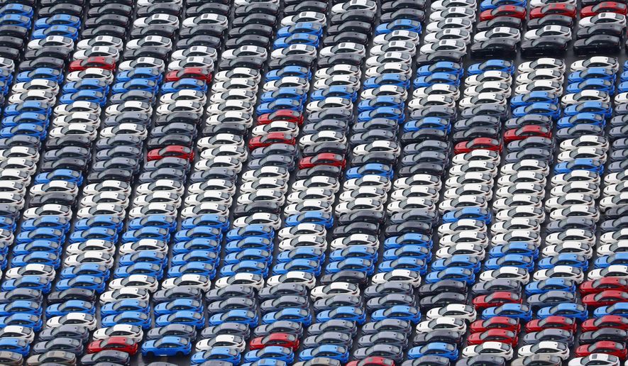 Vehicles are parked for export at a Yokohama port, near Tokyo on Aug. 1, 2025. (Takuto Kaneko/Kyodo News via AP)