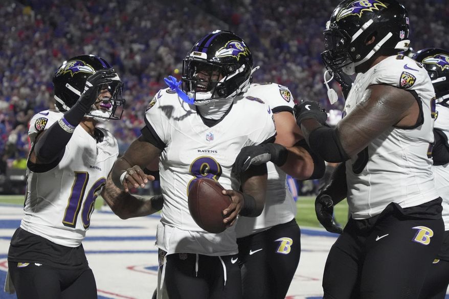 Baltimore Ravens quarterback Lamar Jackson (8) celebrates after a touchdown run against the Buffalo Bills during the first half of an NFL football game in Orchard Park, N.Y., Sunday, Sept. 7, 2025. (AP Photo/Gene J. Puskar)