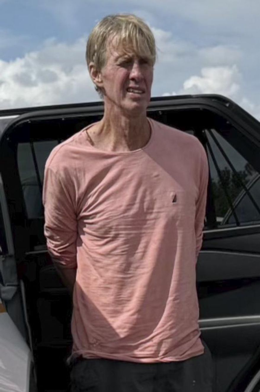 In this image released by the Martin County, Fla., Sheriff's Office, law enforcement officers arrest Ryan Routh, the man suspected in the apparent assassination attempt of Donald Trump, Sunday, Sept. 15, 2024. (Martin County Sheriff's Office via AP, File)