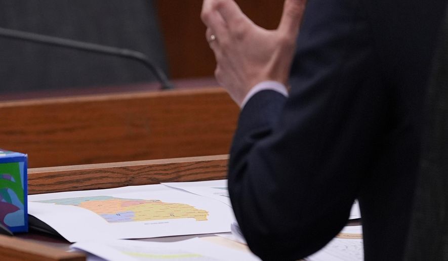 Missouri state Rep. Dirk Deaton, R-Seneca, sponsor of a bill that would redraw the state's U.S. House districts, testifies as a proposed map is seen on the table during a committee hearing on the bill , hursday, Sept. 4, 2025, in Jefferson City, Mo. (AP Photo/Jeff Roberson)