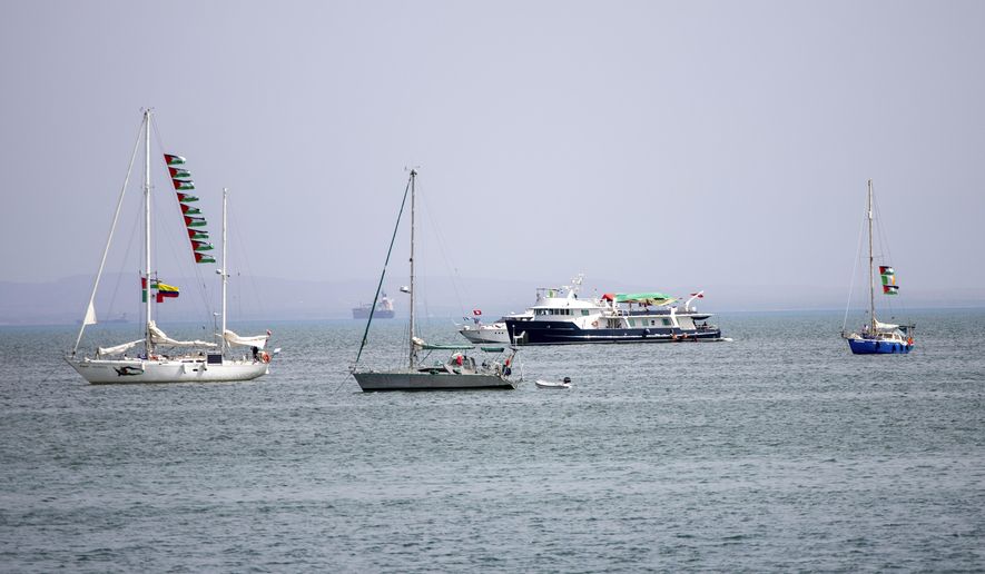 Ships that are part of the Global Sumud Flotilla heading to Gaza are anchored off the coast of of Sidi Bou Saïd in Tunis, Tunisia, Tuesday, Sept. 9, 2025. (AP Photo/Anis Mili)