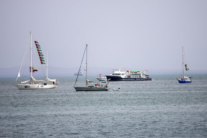 Ships that are part of the Global Sumud Flotilla heading to Gaza are anchored off the coast of of Sidi Bou Saïd in Tunis, Tunisia, Tuesday, Sept. 9, 2025. (AP Photo/Anis Mili)