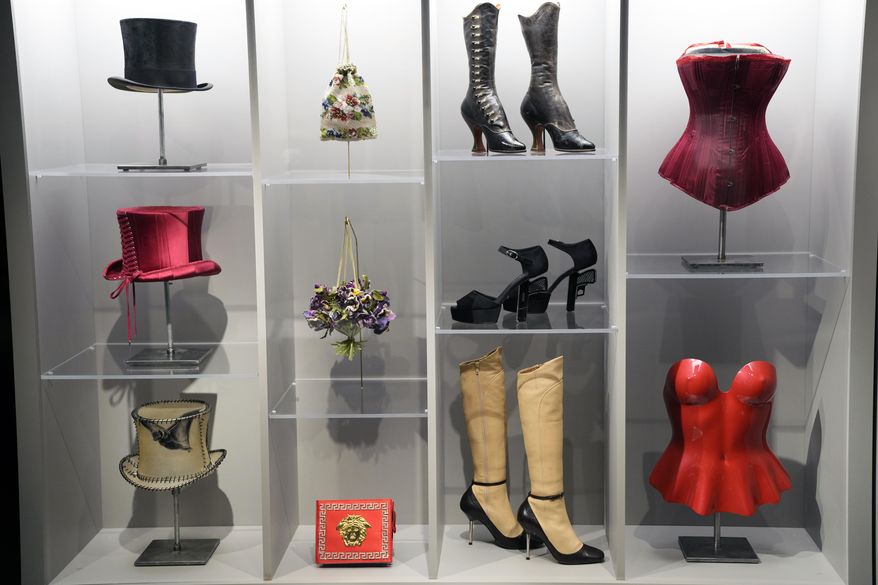 Various fashion pieces are displayed during a press preview for the exhibit "Dress, Dreams and Desire: Fashion and Psychoanalysis" on Tuesday, Sept. 9, 2025, at The Museum at FIT in New York. (Photo by Charles Sykes/Invision/AP)