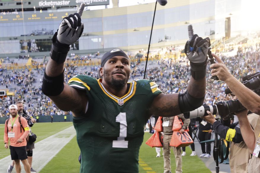 Green Bay Packers defensive end Micah Parsons (1) celebrates after an NFL football game against the Detroit Lions Sunday, Sept. 7, 2025, in Green Bay, Wis. (AP Photo/Mike Roemer)