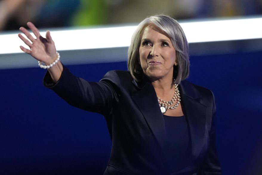FILE - New Mexico Gov. Michelle Lujan Grisham waves during the Democratic National Convention Aug. 20, 2024, in Chicago. (AP Photo/Charles Rex Arbogast, File)