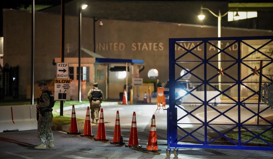 Response vehicles leave through the main gate of the Naval Academy, Thursday, Sept. 11, 2025, in Annapolis, Md. (Ulysses Muñoz/The Baltimore Banner via AP)
