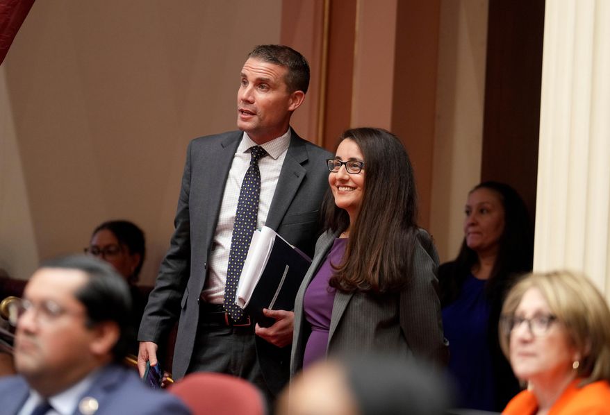 State Senate President Pro Tempore Mike McGuire and Democratic state Sen. Monique Limon watch as the votes are counted on a bill before the Senate at the Capitol, in Sacramento, Calif., Thursday, Sept. 11, 2025. (AP Photo/Rich Pedroncelli)
