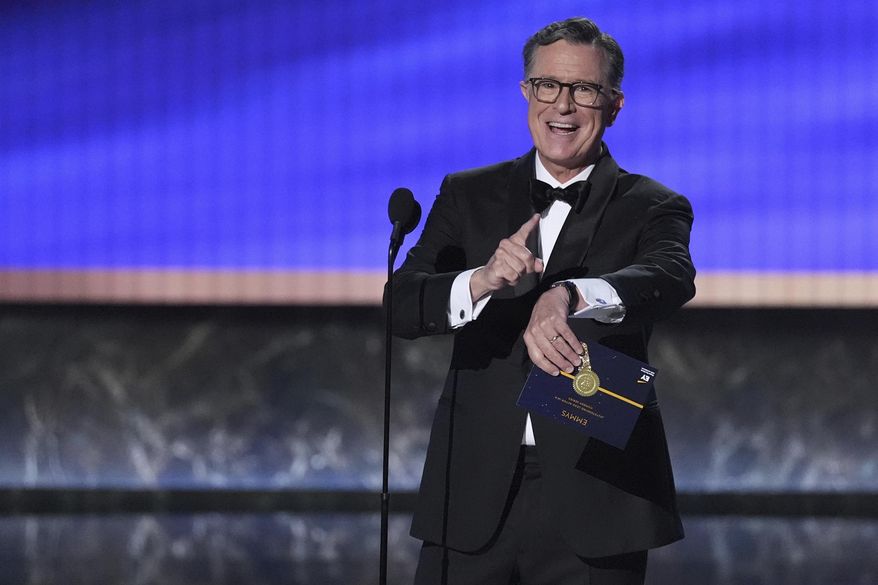 Stephen Colbert presents the award for outstanding lead actor in a comedy series during the 77th Primetime Emmy Awards on Sunday, Sept. 14, 2025, at the Peacock Theater in Los Angeles. (AP Photo/Chris Pizzello)