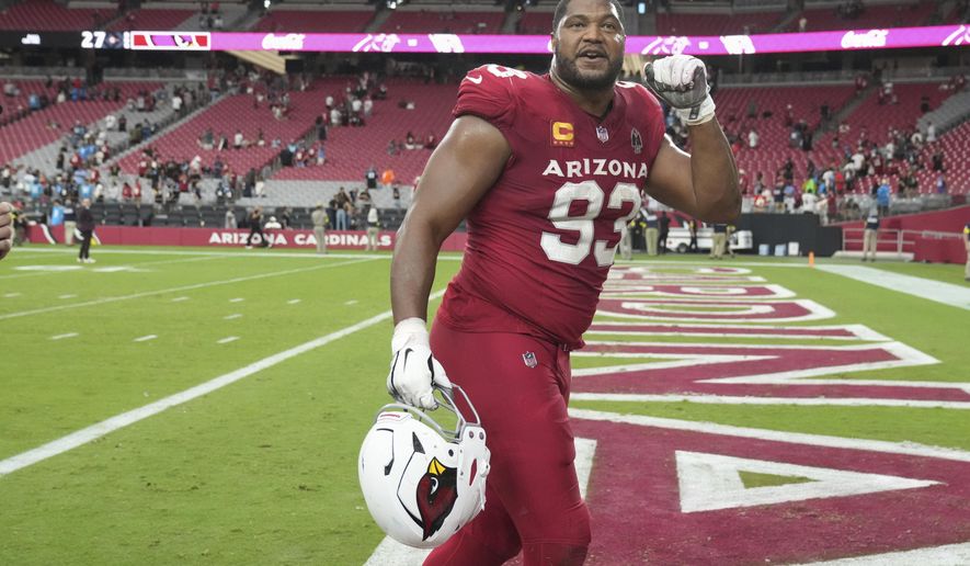Arizona Cardinals defensive tackle Calais Campbell (93) leaves the field after an NFL football game against the Carolina Panthers, Sunday, Sept. 14, 2025, in Glendale, Ariz. (AP Photo/Rick Scuteri)