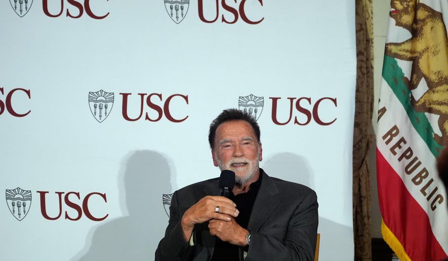 Former California Gov. Arnold Schwarzenegger, right, expresses his opposition to Proposition 50, a California ballot measure to redraw U.S. House maps to boost Democrats, during a conversation with University of Southern California interim president Beong-Soo Kim, not shown, on democracy at the USC campus in Los Angeles, Monday, Sept. 15, 2025 (AP Photo/Damian Dovarganes)