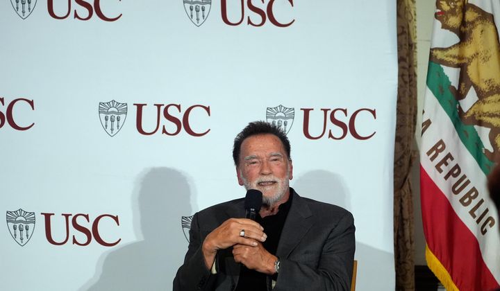 Former California Gov. Arnold Schwarzenegger, right, expresses his opposition to Proposition 50, a California ballot measure to redraw U.S. House maps to boost Democrats, during a conversation with University of Southern California interim president Beong-Soo Kim, not shown, on democracy at the USC campus in Los Angeles, Monday, Sept. 15, 2025 (AP Photo/Damian Dovarganes)