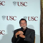 Former California Gov. Arnold Schwarzenegger, right, expresses his opposition to Proposition 50, a California ballot measure to redraw U.S. House maps to boost Democrats, during a conversation with University of Southern California interim president Beong-Soo Kim, not shown, on democracy at the USC campus in Los Angeles, Monday, Sept. 15, 2025 (AP Photo/Damian Dovarganes)