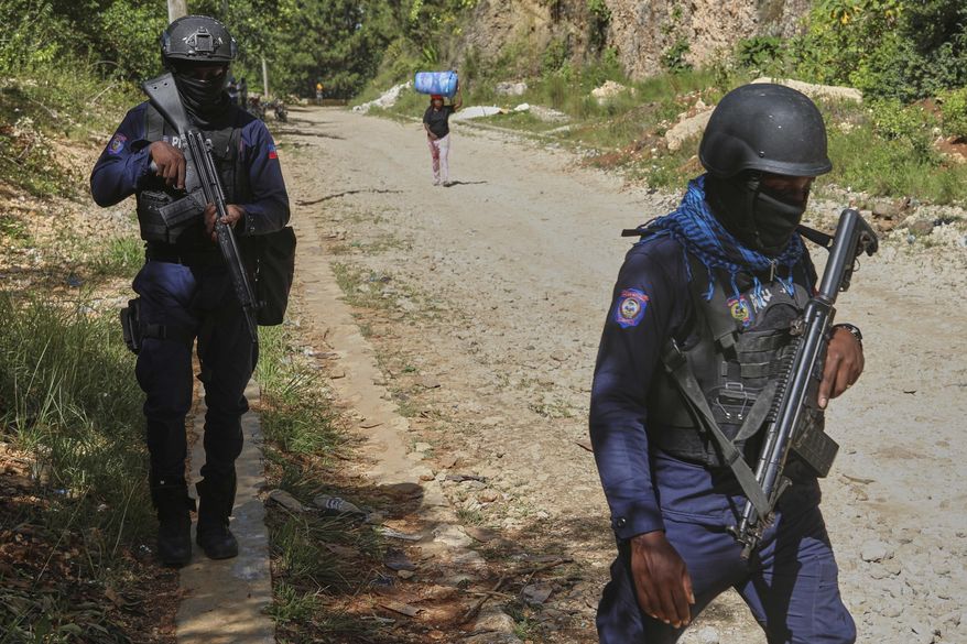FILE - Police officers patrol the area near the Saint-Helene orphanage in the Kenscoff neighborhood of Port-au-Prince, Haiti, Aug. 4, 2025. (AP Photo/Odelyn Joseph, File)