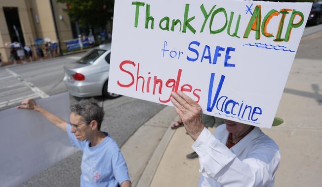 FILE - Demonstrators rally for support of the CDC during a meeting of the Advisory Committee in Immunization Practices, June 25, 2025, in Atlanta. (AP Photo/Mike Stewart, File)