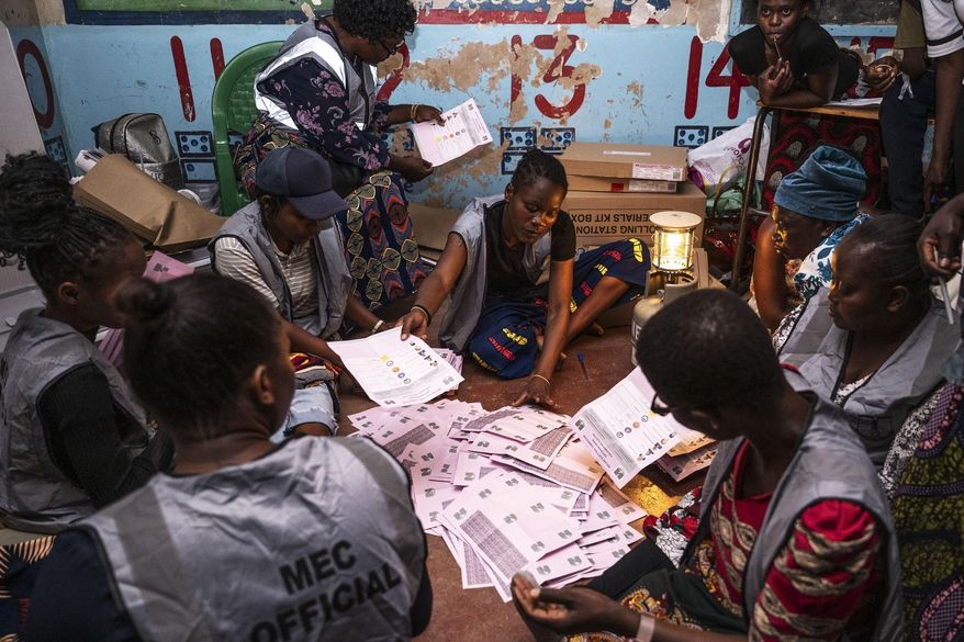 Election volunteers count ballots in Blantyre, Malawi, Tuesday, Sept. 16, 2025. (AP Photo/Thoko Chikondi)