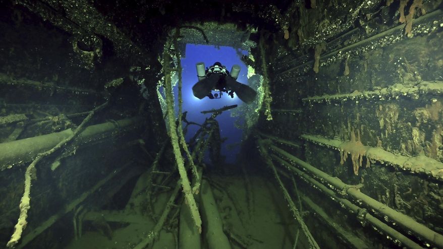 In this undated photo provided by the Greek Culture Ministry on Monday, Sept. 15, 2025, divers illuminate the wreck's interior of the Britannic, sister ship to the Titanic, for the first time since the ocean liner sank in the Aegean Sea more than a century ago after striking a mine during World War I. (Greek Culture Ministry via AP)