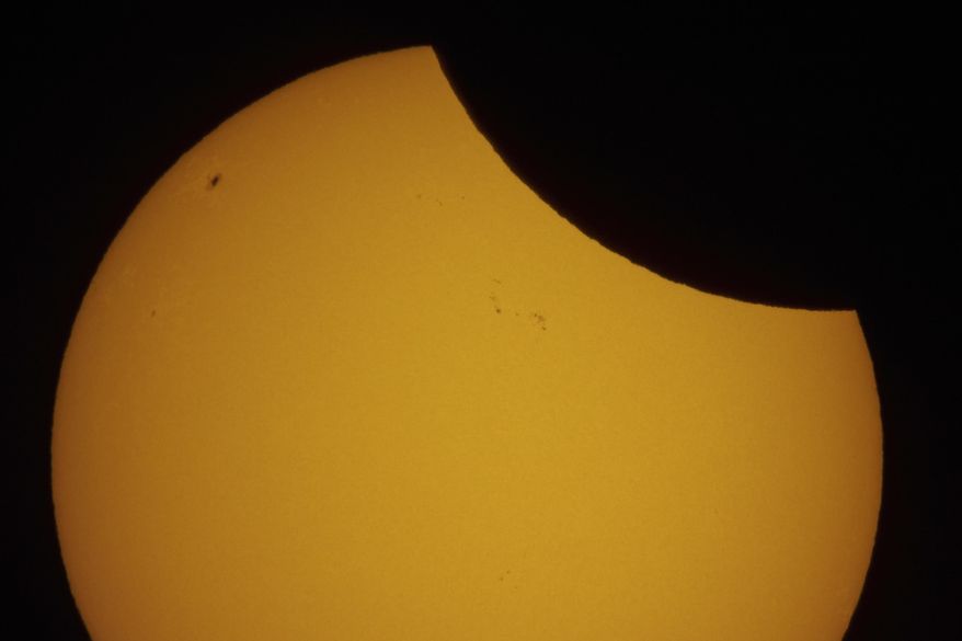 FILE - A view of a partial solar eclipse over St. Petersburg, Russia, March 29, 2025. (AP Photo/Dmitri Lovetsky, file)