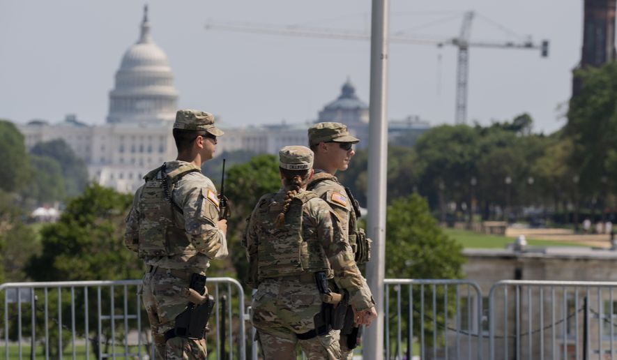 Members of the Ohio National Guard patrol the National Mall Sunday, Sept. 14, 2025, in Washington. (AP Photo/Jose Luis Magana) ** FILE **