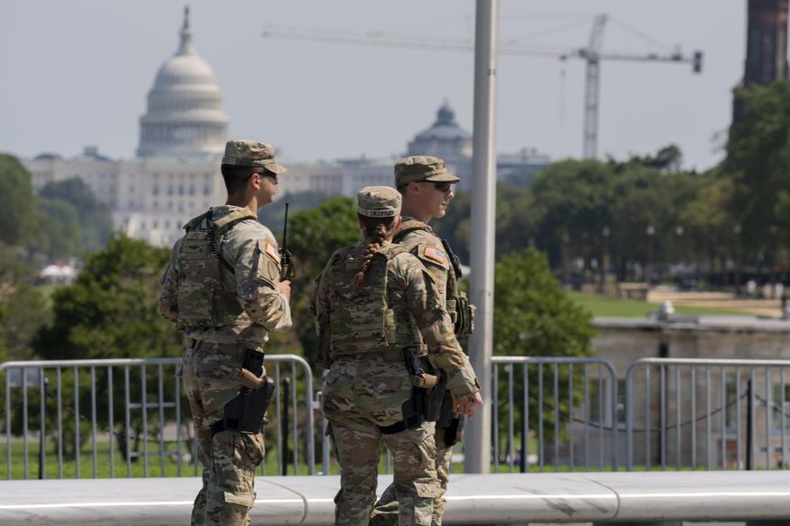 Members of the Ohio National Guard patrol the National Mall Sunday, Sept. 14, 2025, in Washington. (AP Photo/Jose Luis Magana) ** FILE **