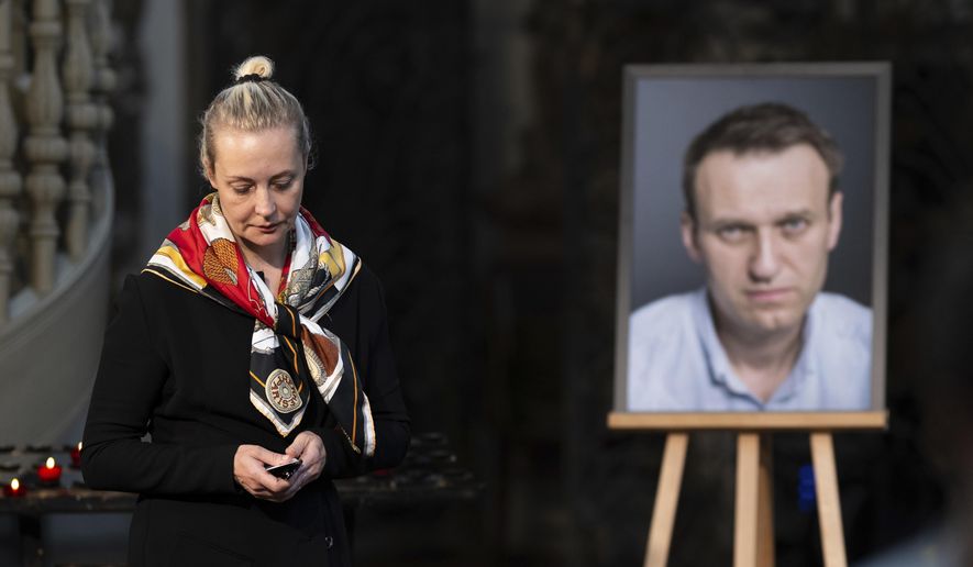 Yulia Navalnaya, widow of Russian opposition leader Alexei Navalny walks away from his picture after lighting a candle at the end of a service in St. Mary's Church on the occasion of his birthday, in Berlin, June 4, 2024. (Christoph Gollnow/dpa/dpa via AP, File)