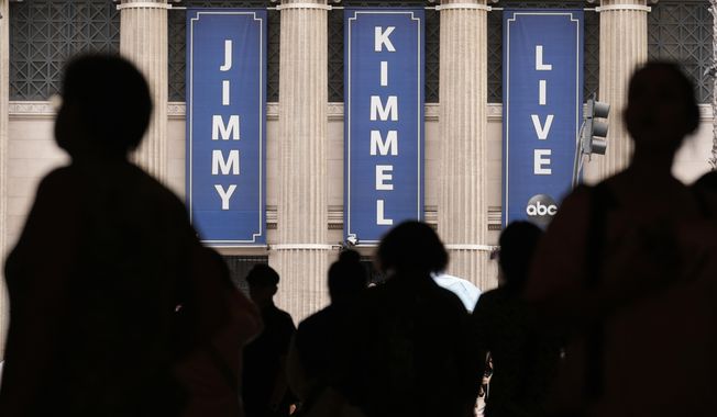 People walk by the Jimmy Kimmel Live studio on Hollywood Blvd., Wednesday, Sept. 17, 2025, in Los Angeles. (AP Photo/Chris Pizzello)