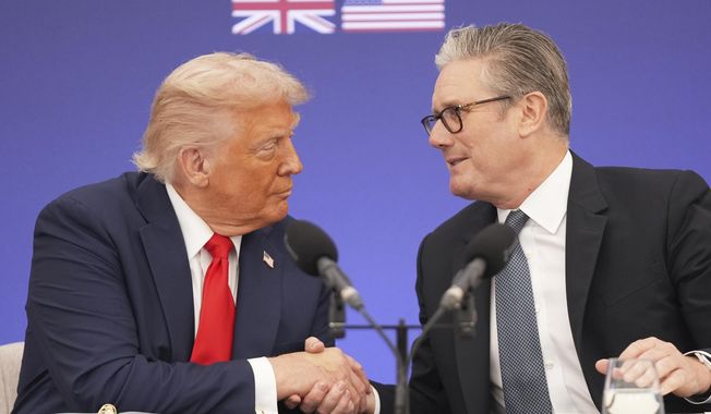 President Donald Trump and Britain's Prime Minister Keir Starmer shake hands during a business roundtable at Chequers near Aylesbury, England, Thursday, Sept. 18, 2025. (AP Photo/Evan Vucci)
