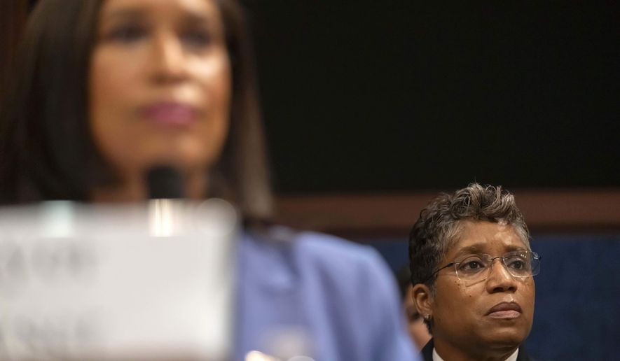 District of Columbia Police Chief Pamela Smith, right, and Mayor Muriel Bowser listen during a hearing of the House Committee on Oversight and Government Reform on Capitol Hill, Thursday, Sept. 18, 2025, in Washington. (AP Photo/Mark Schiefelbein)