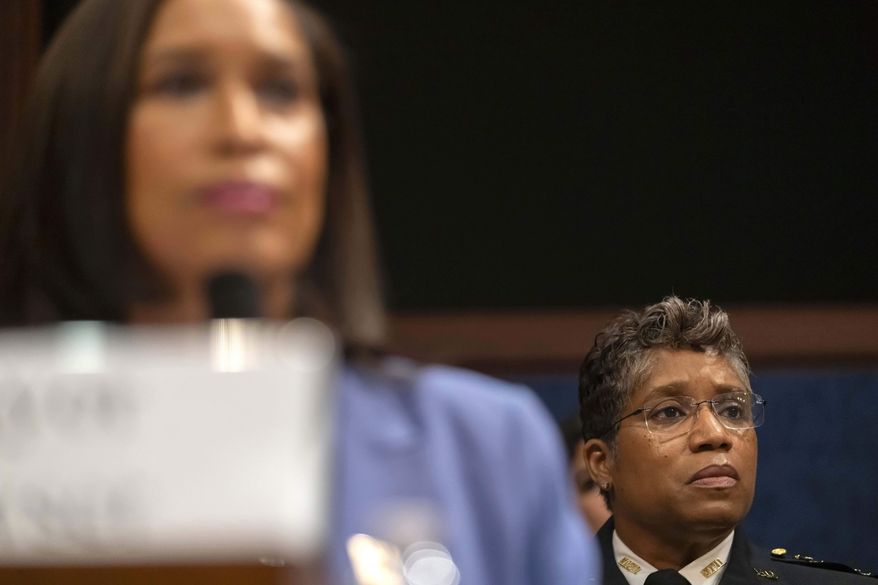 District of Columbia Police Chief Pamela Smith, right, and Mayor Muriel Bowser listen during a hearing of the House Committee on Oversight and Government Reform on Capitol Hill, Thursday, Sept. 18, 2025, in Washington. (AP Photo/Mark Schiefelbein)