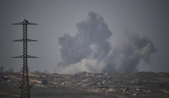 Smoke rises to the sky following an Israeli military strike in the Gaza Strip, as seen from southern Israel, Thursday, Sept. 18, 2025. (AP Photo/Leo Correa)