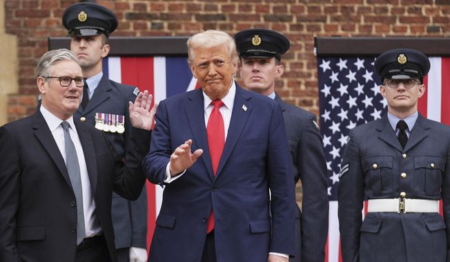 President Donald Trump waves next to Britain's Prime Minister Keir Starmer upon arriving at Chequers near Aylesbury, England, Thursday, Sept. 18, 2025. (AP Photo/Evan Vucci)