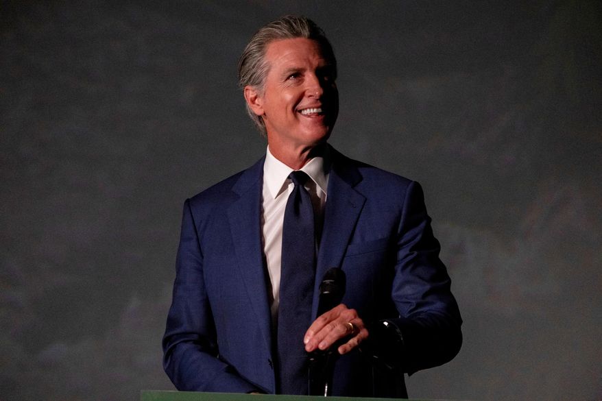 California Gov. Gavin Newsom hosts a press conference and signs a slew of climate initiative bills at the Academy of Sciences, Friday, Sept. 19, 2025, in San Francisco. (AP Photo/Camille Cohen)
