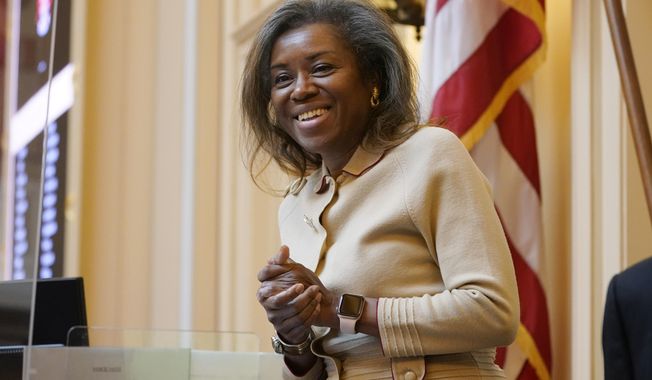 FILE - Virginia Lt. Gov. Winsome Earle-Sears greets visitors prior to the start of the Senate Session at the Virginia Capitol, Jan. 25, 2022, in Richmond, Va. (AP Photo/Steve Helber, File)