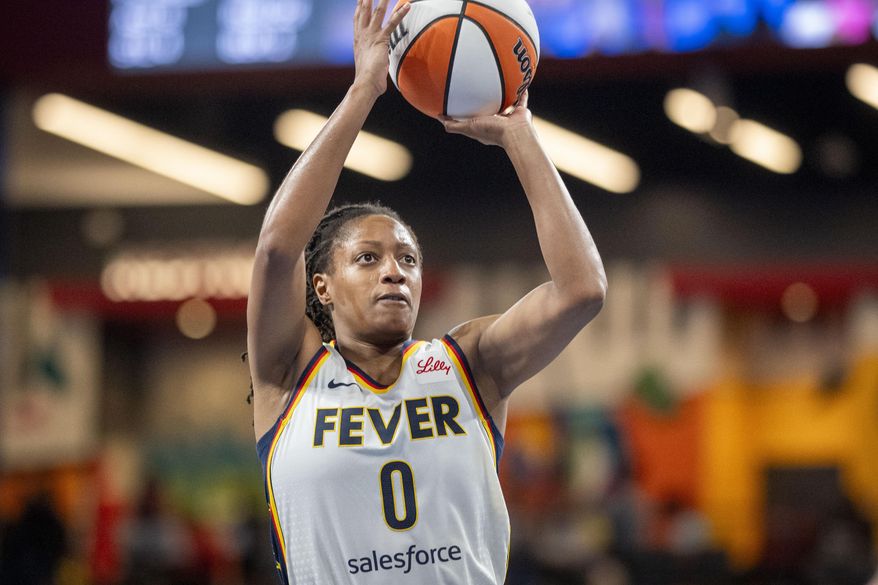 Indiana Fever guard Kelsey Mitchell attempts a basket during the second half of Game 1 against the Atlanta Dream in the first round of the WNBA basketball playoffs Sunday, Sept. 14, 2025, in Atlanta. (AP Photo/Erik Rank)