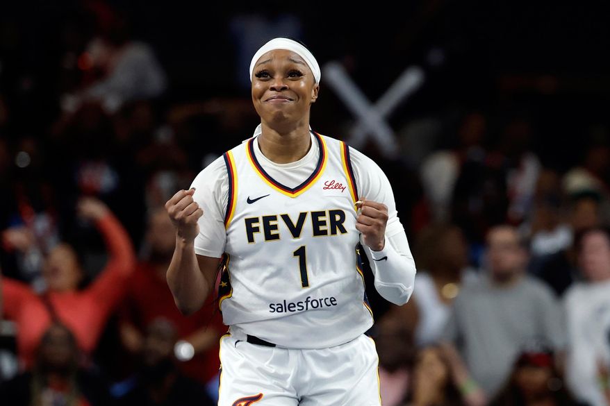 Indiana Fever guard Odyssey Sims reacts after her team took the lead over the Atlanta Dream during the second half of Game 3 in the first round of the WNBA basketball playoffs, Thursday, Sept. 18, 2025, in Atlanta. (AP Photo/Butch Dill)