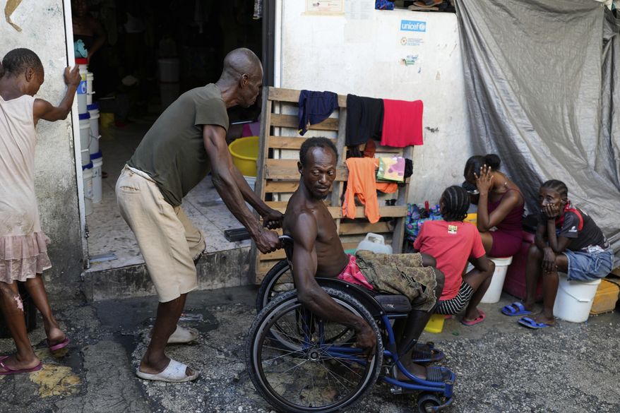 People displaced by gang violence spend time at a makeshift shelter in Port-au-Prince, Haiti, Wednesday, Sept. 17, 2025. (AP Photo/Odelyn Joseph)