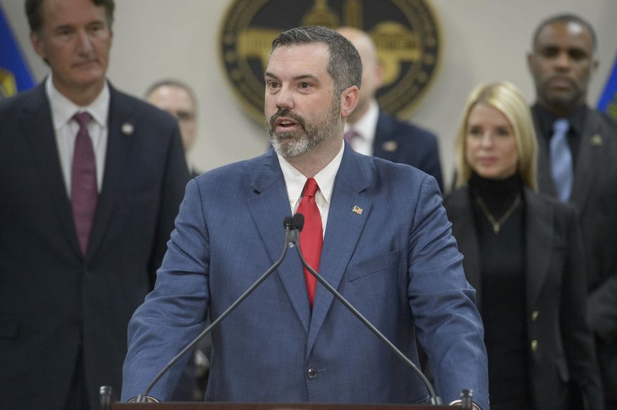 Erik Siebert, interim U.S. Attorney for the Eastern District of Virginia, speaks as Attorney General Pam Bondi, right, and Virginia Gov. Glenn Youngkin, left, listen during a news conference at the Manassas FBI Field Office, March 27, 2025, in Manassas, Va. (AP Photo/Rod Lamkey Jr.,) **FILE**