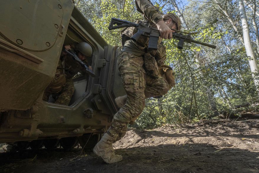 Ukrainian servicemen of 13th brigade take part in training at the training field in Kharkiv region, Ukraine Friday, Aug. 29, 2024. (AP Photo/Andrii Marienko)