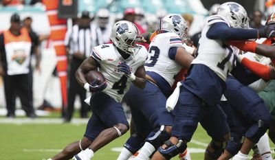 Howard running back Travis Kerney (4) runs during the first half of the Orange Blossom Classic NCAA college football game against Florida A&M, Saturday, Aug. 30, 2025, in Miami Gardens, Fla. (AP Photo/Lynne Sladky) **FILE**