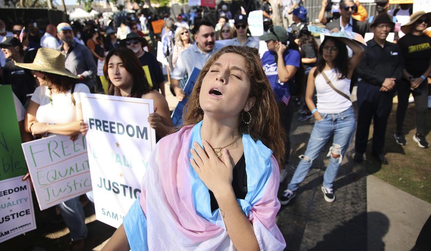 Supporters gather during an immigration rally on Saturday, Sept. 20, 2025, in Los Angeles. (AP Photo/Ethan Swope)