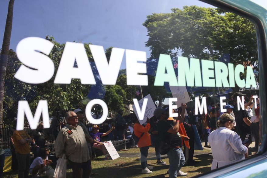 Supporters gather during an immigration rally on Saturday, Sept. 20, 2025, in Los Angeles. (AP Photo/Ethan Swope)