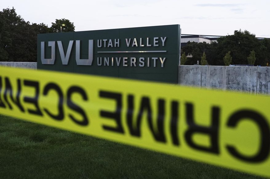Crime scene tape surrounds Utah Valley University after Turning Point USA CEO and co-founder Charlie Kirk was shot and killed , Saturday, Sept. 13, 2025, in Orem, Utah. (AP Photo/Lindsey Wasson)