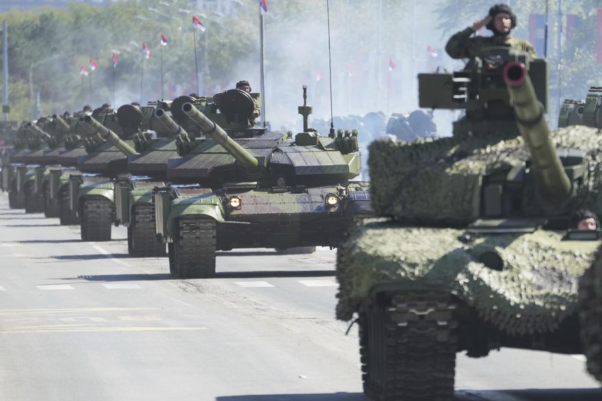 Serbian Army soldiers perform during a military parade in Belgrade, Serbia, Saturday, Sept. 20, 2025. (AP Photo/Darko Vojinovic)