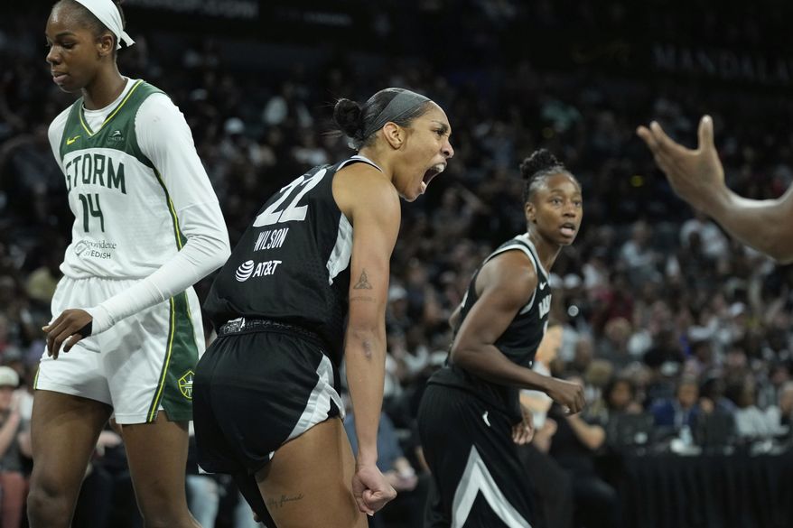 Las Vegas Aces center A'ja Wilson (22) celebrates after a play against the Seattle Storm during the second half of Game 3 in the first round of the WNBA basketball playoffs Thursday, Sept. 18, 2025, in Las Vegas. (AP Photo/John Locher)