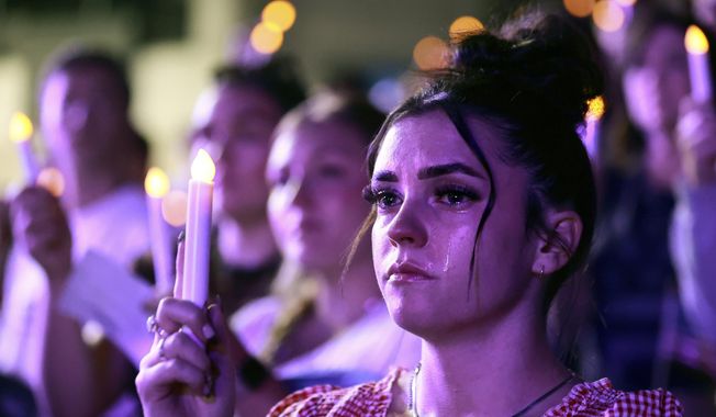 Tears stream down Alexa Maliwauki's face as she attends a Vigil for Unity at the UCCU Center at Utah Valley University in Orem on Friday, Sept. 19, 2025. Charlie Kirk, conservative activist and the founder and president of Turning Point USA, was fatally shot while answering questions at his American Comeback Tour at UVU on Sept. 10. (Kristin Murphy/The Deseret News via AP)