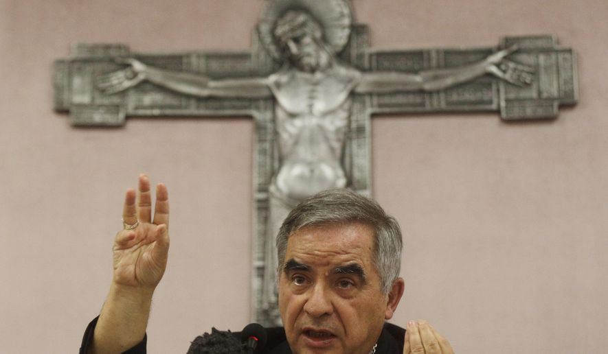 Cardinal Angelo Becciu talks to journalists during news conference in Rome, Sept. 25, 2020. (AP Photo/Gregorio Borgia, File)