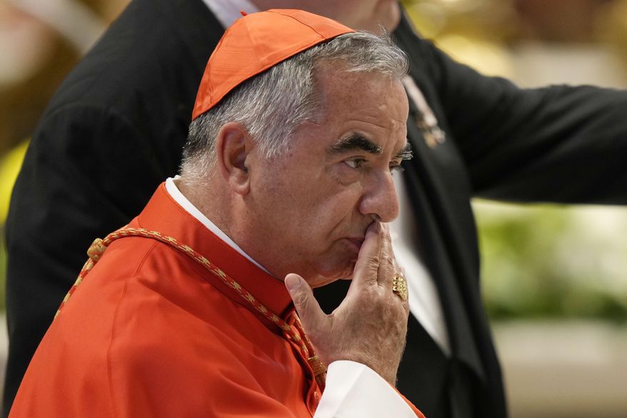 Cardinal Angelo Becciu attends the consistory inside St. Peter's Basilica at the Vatican, Aug. 27, 2022. (AP Photo/Andrew Medichini, File)