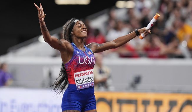 United States' Sha'Carri Richardson reacts after winning the women's 4 X 100 meters relay at the World Athletics Championships in Tokyo, Sunday, Sept. 21, 2025. (AP Photo/Eugene Hoshiko)