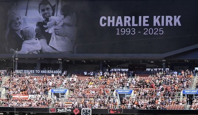 A memorial for Charlie Kirk is seen at Huntington Bank Field during the first half of an NFL football game between the Green Bay Packers and the Cleveland Browns Sunday, Sept. 21, 2025, in Cleveland. (AP Photo/David Richard)