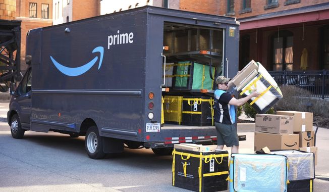 FILE - An Amazon Prime driver makes a delivery outside an apartment building in Pittsburgh, March 10, 2025. (AP Photo/Gene J. Puskar, File)
