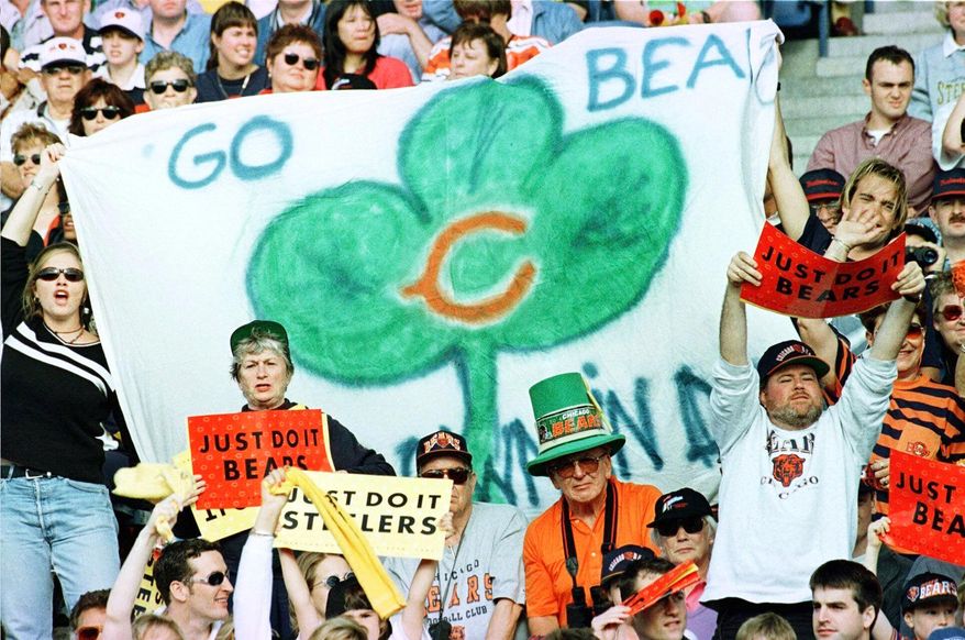 FILE - Football fans cheer during American Bowl action between the Chic ago Bears and the Pittsburgh Steelers at Croke Park in Dublin, Ireland, Sunday, July 27, 1997. (AP Photo/Adrian Dennis, File)